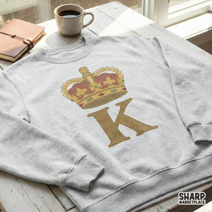 Distressed golden letter K topped with an ornate royal crown, displayed as a printable sublimation graphic for custom apparel and DIY projects.