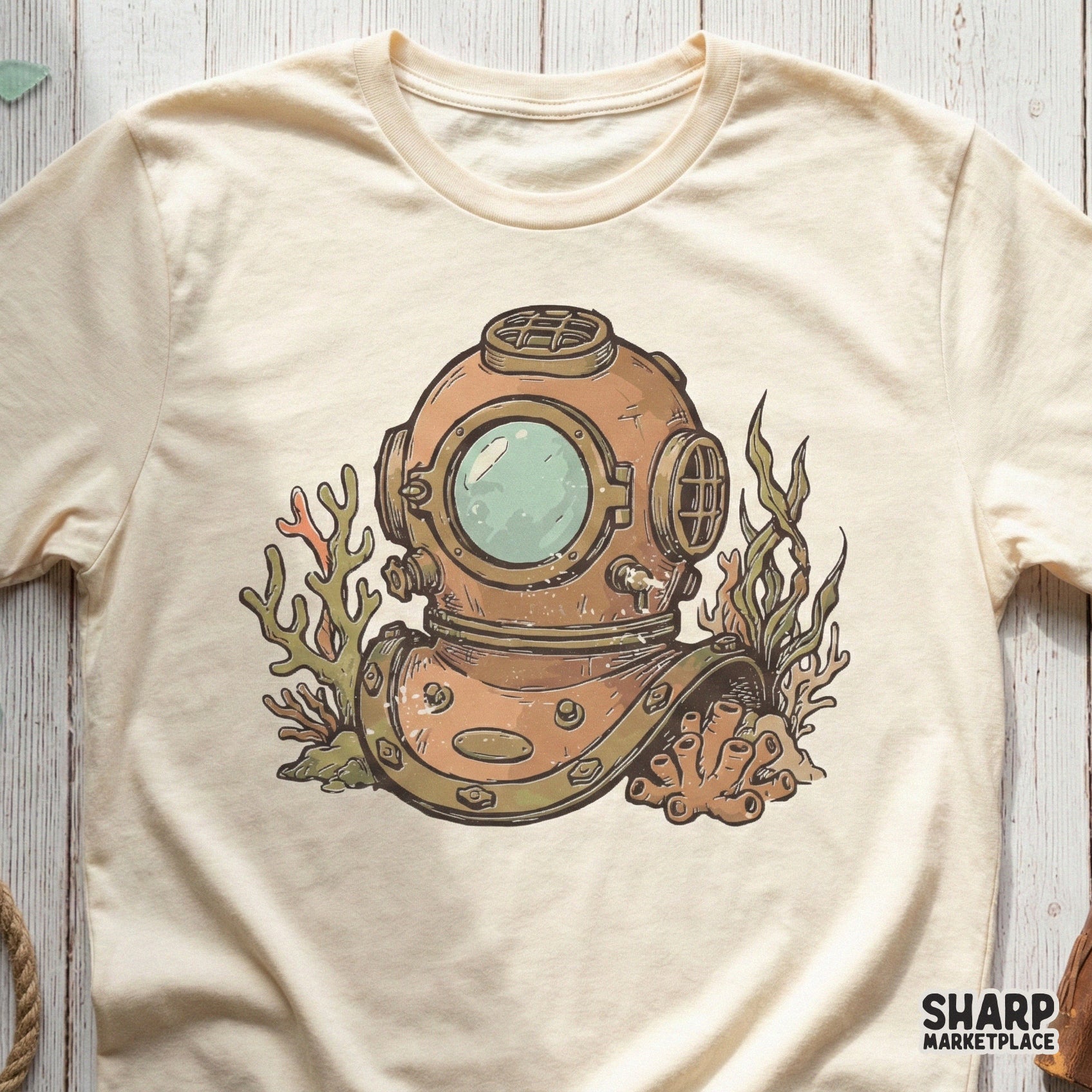 Retro deep sea diver helmet graphic printed on a cream colored t-shirt, featuring a distressed nautical style for apparel and sublimation.