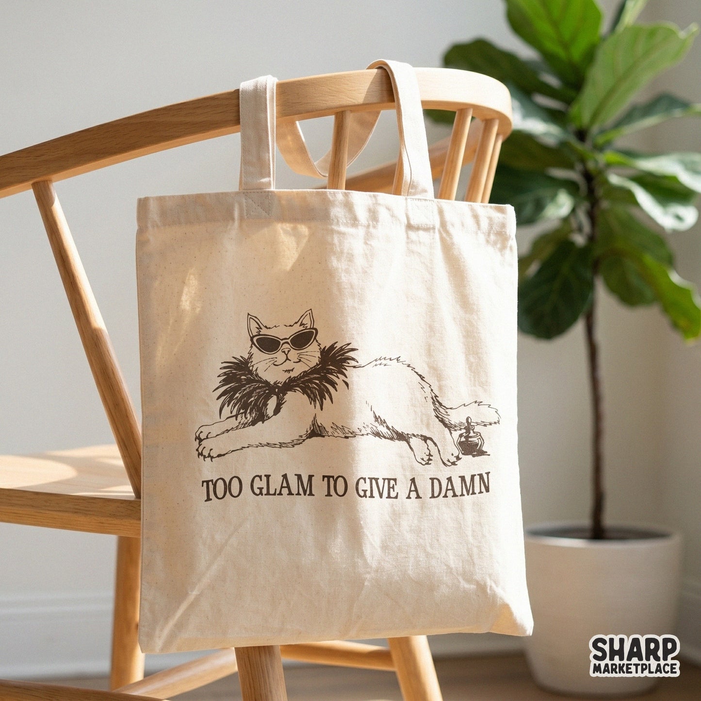 Funny cat graphic with sunglasses and a feathered boa, featuring the text Too Glam To Give A Damn for use on shirts, tumblers, and DIY crafts.