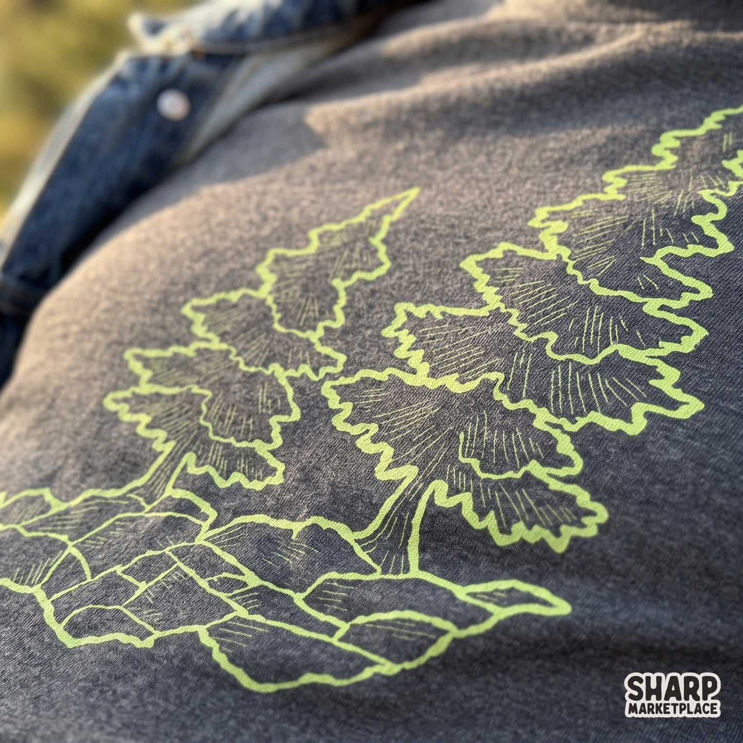 Minimalist forest line art illustration of green pine trees on rocks for camping sublimation shirt designs