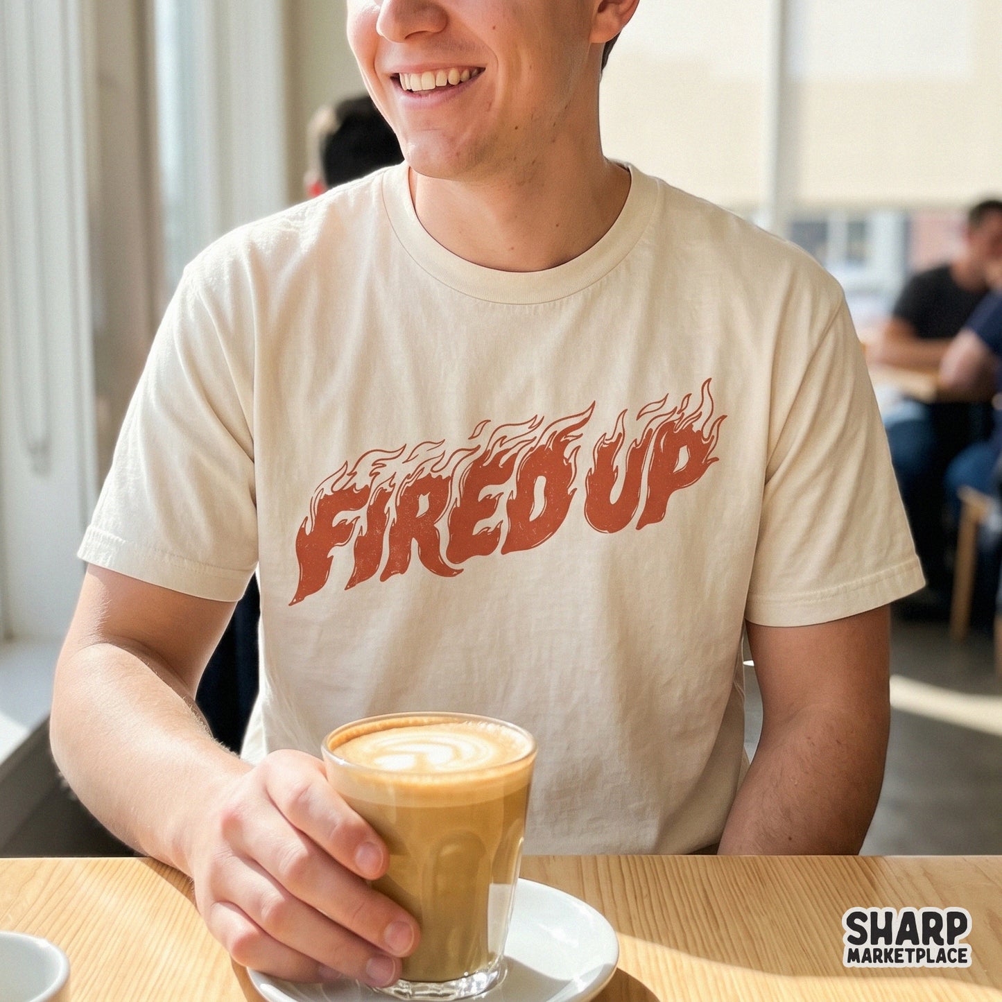 Trendy Fired Up flame typography design displayed on a neutral t-shirt mockup, featuring bold hand-drawn letters with a vintage heat aesthetic.