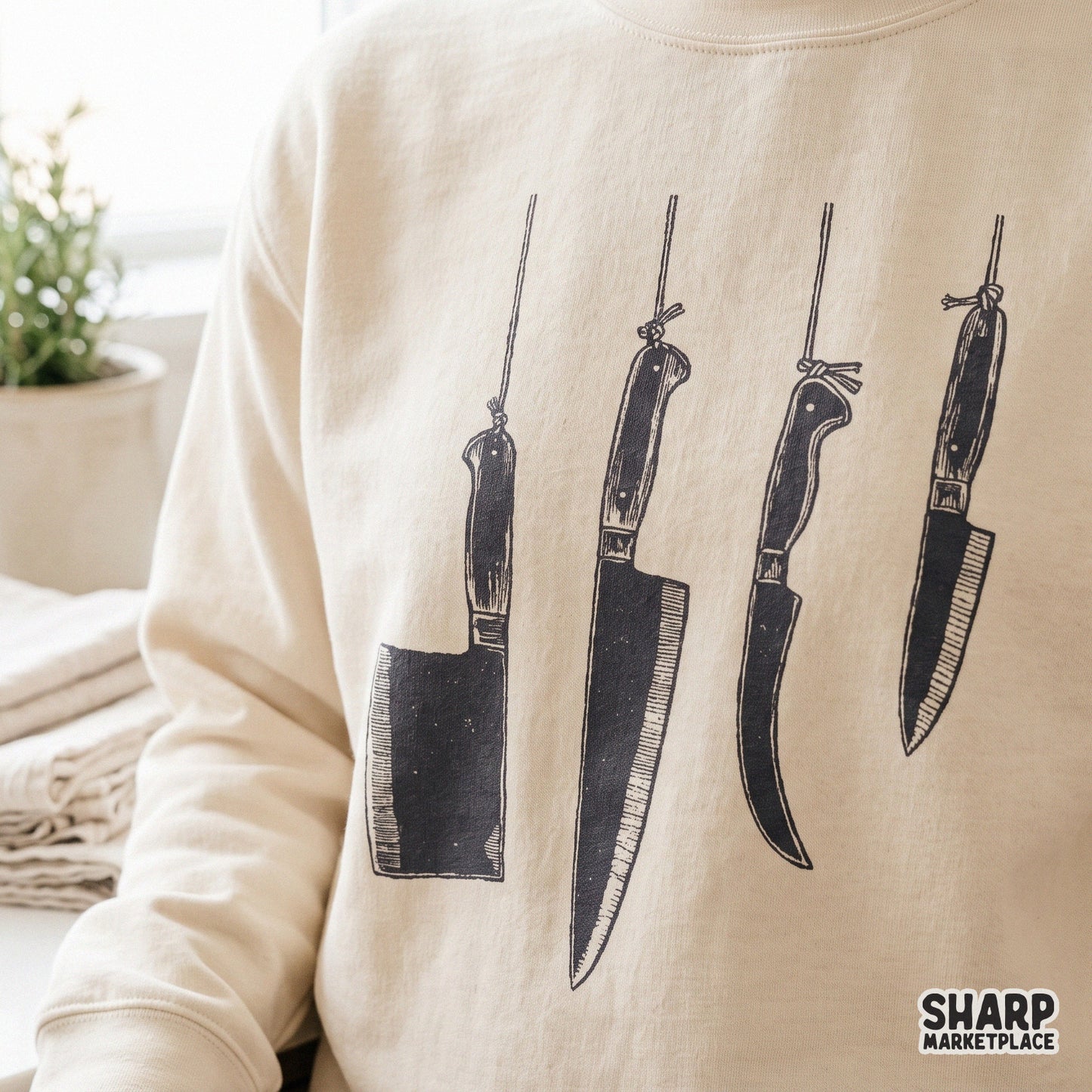 Hanging butcher knives in a retro dark art style for true crime and spooky Halloween PNG shirt designs