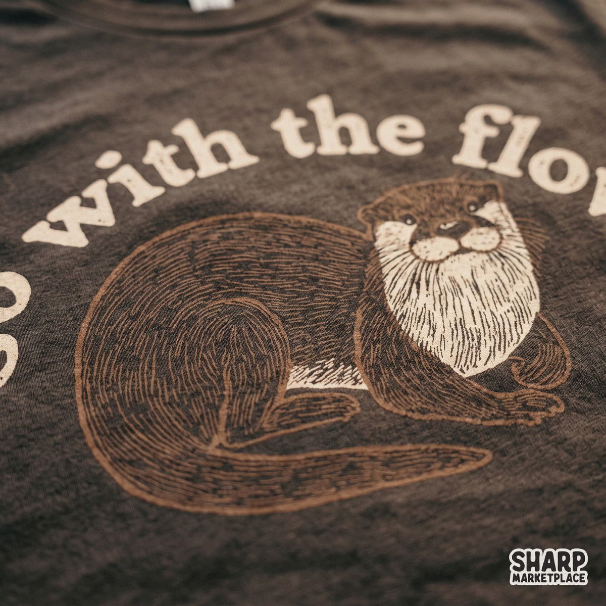 Cute retro sea otter illustration with Go With The Flow text for summer shirt png designs and animal lovers