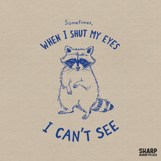 Hand-drawn blue ink sketch of a sleepy raccoon with the sarcastic text Sometimes, When I Shut My Eyes I Can't See, perfect for apparel printing.