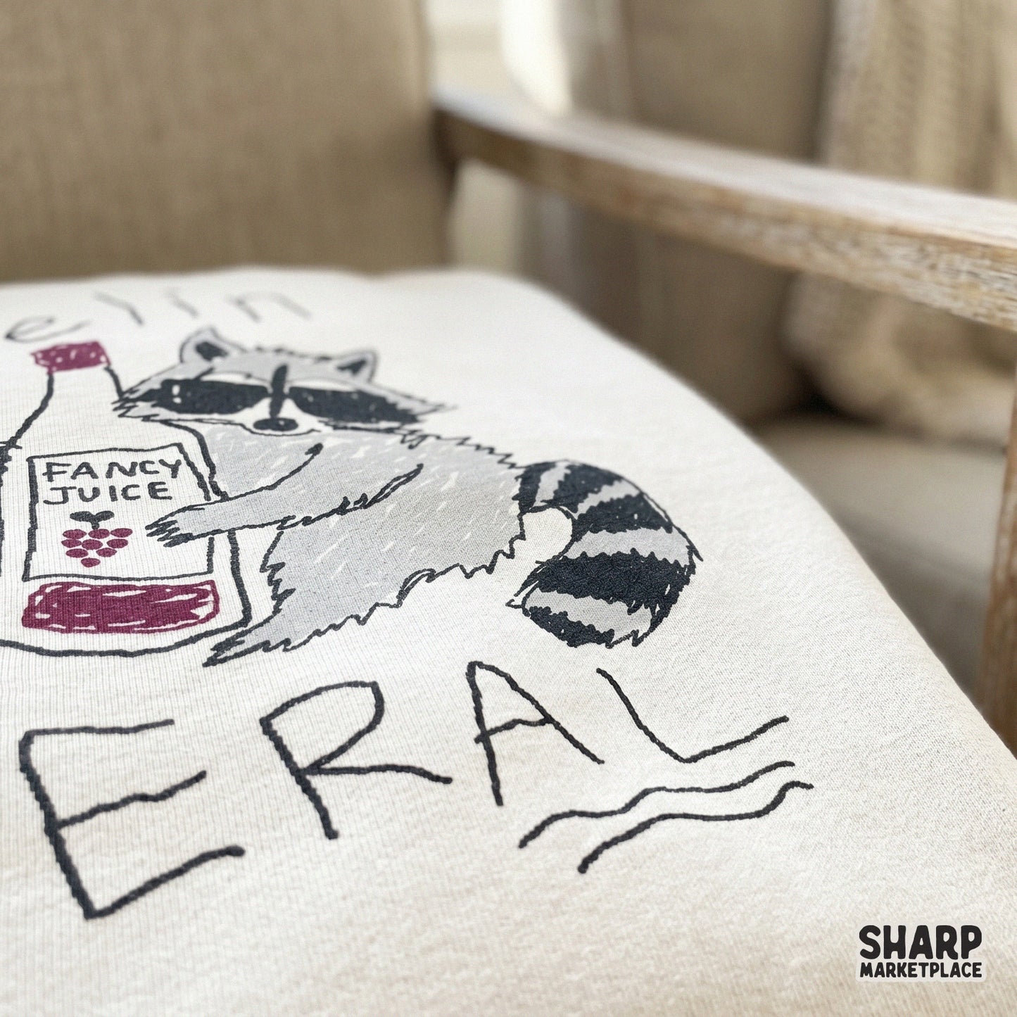 Sarcastic raccoon artwork with a hand-lettered quote Feelin Feral and wine imagery, designed for high-quality print-on-demand or craft projects.
