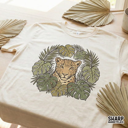 Boho style leopard jungle illustration with distressed texture, featuring a wild cat framed by botanical leaves for DIY printing projects.