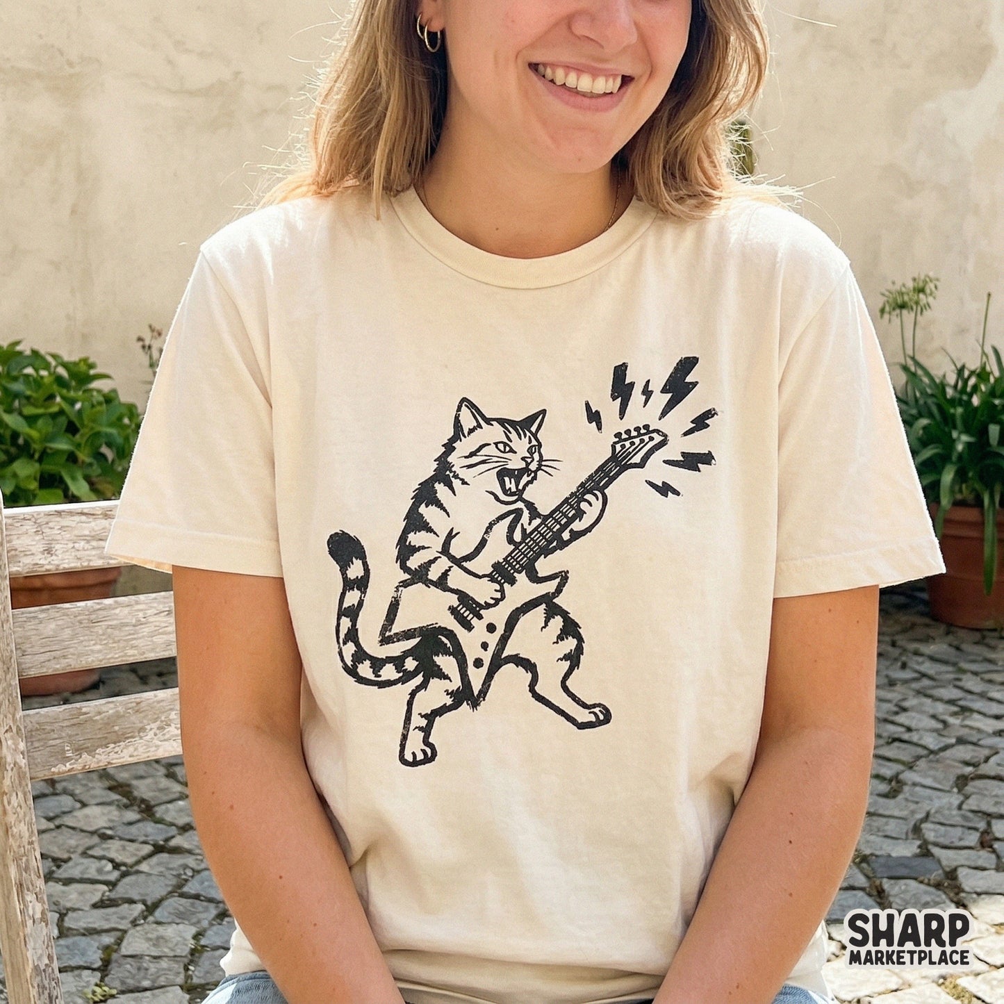 Detailed black and white digital art of a rockstar tabby cat with lightning riffs, perfect for sublimation, stickers, or custom music-themed apparel.