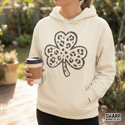 Vintage-inspired three-leaf clover graphic featuring a bold spotted animal print texture, suitable for custom holiday shirts, stickers, and tumblers.
