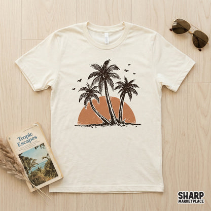 A cream-colored t-shirt featuring a vintage-style tropical palm tree trio and sunset graphic, ideal for summer fashion and coastal-themed DIY projects.
