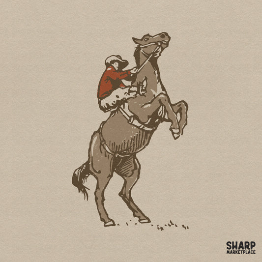 Vintage western design of a cowboy riding a bucking bronco, featuring a rustic red shirt and earthy brown tones in a textured woodcut illustration style.
