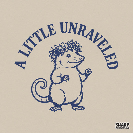 Navy blue line art of a cute opossum wearing a flower crown with the arched text A Little Unraveled, perfect for sublimation and apparel.