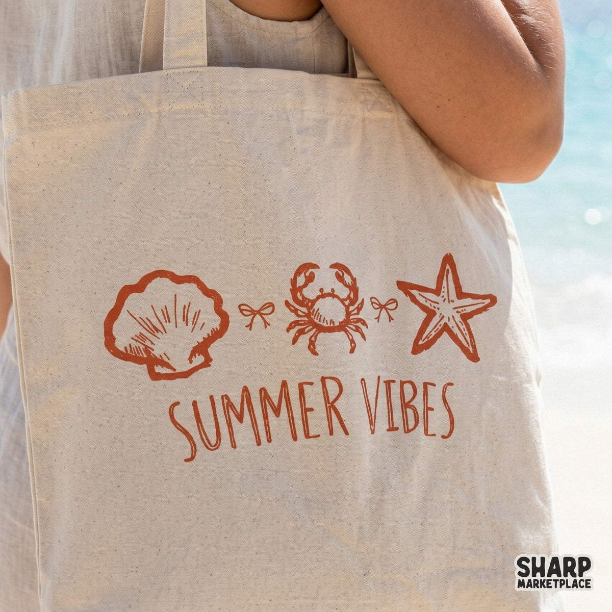 Summer Vibes digital design on a canvas tote bag, featuring a hand-drawn beach trio of a shell, crab, and starfish in a trendy retro orange ink.