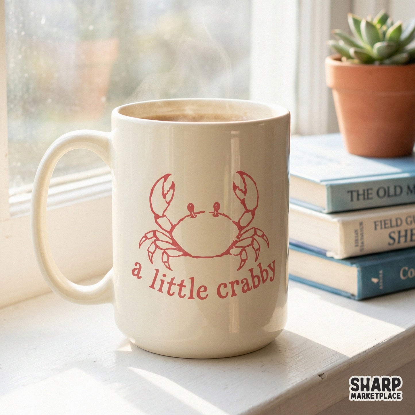 A coffee mug featuring a hand-drawn red crab design and the sarcastic phrase a little crabby, ideal for sublimation printing on drinkware.