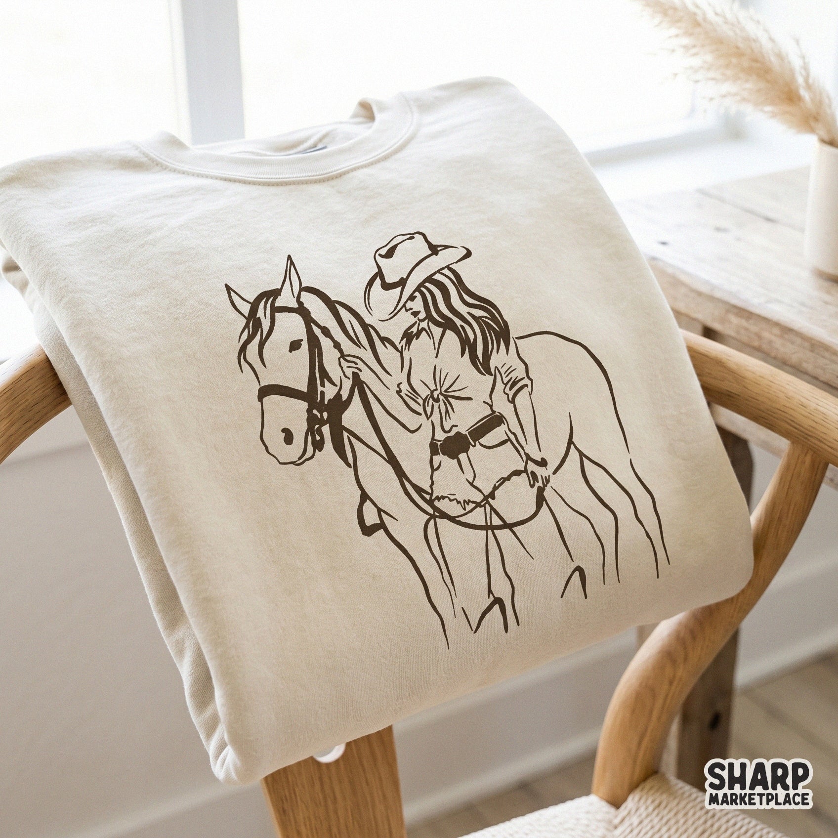 Elegant western-inspired sketch of a cowgirl with her horse, a versatile digital graphic for DIY projects, custom clothing, and trendy ranch-themed gifts.