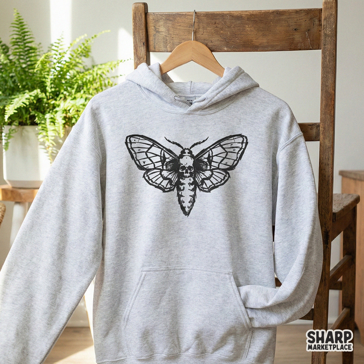 Detailed digital illustration of a death moth with a skull pattern on its body, presented as a high-quality graphic for gothic-themed DIY projects.