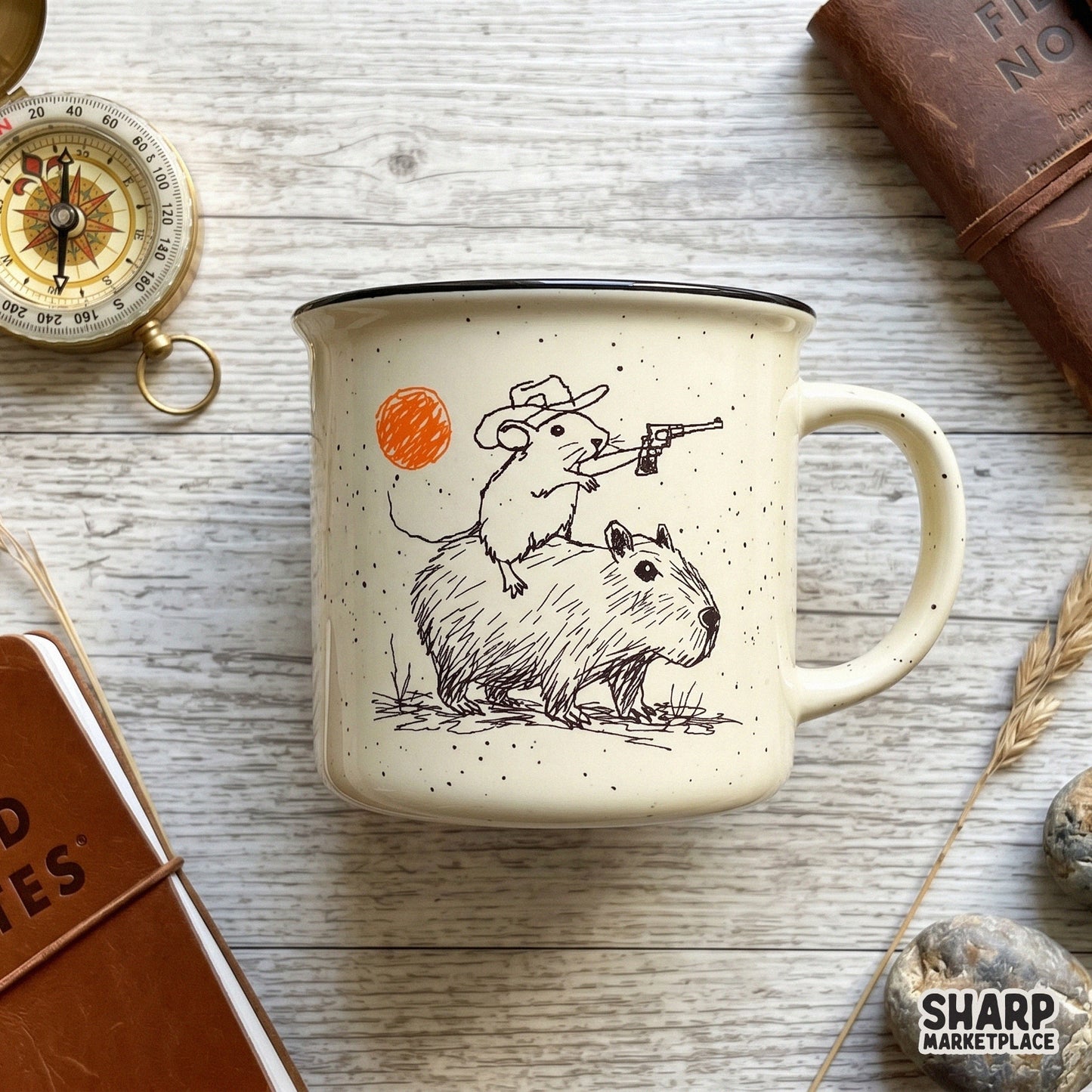 Whimsical western sketch design featuring a rat outlaw on a capybara, printed on a speckled ceramic mug for a trendy and funny apparel aesthetic.