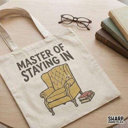 Cozy homebody digital design featuring a tufted yellow chair and books with arched text, ideal for custom stickers, tote bags, and printable wall art.