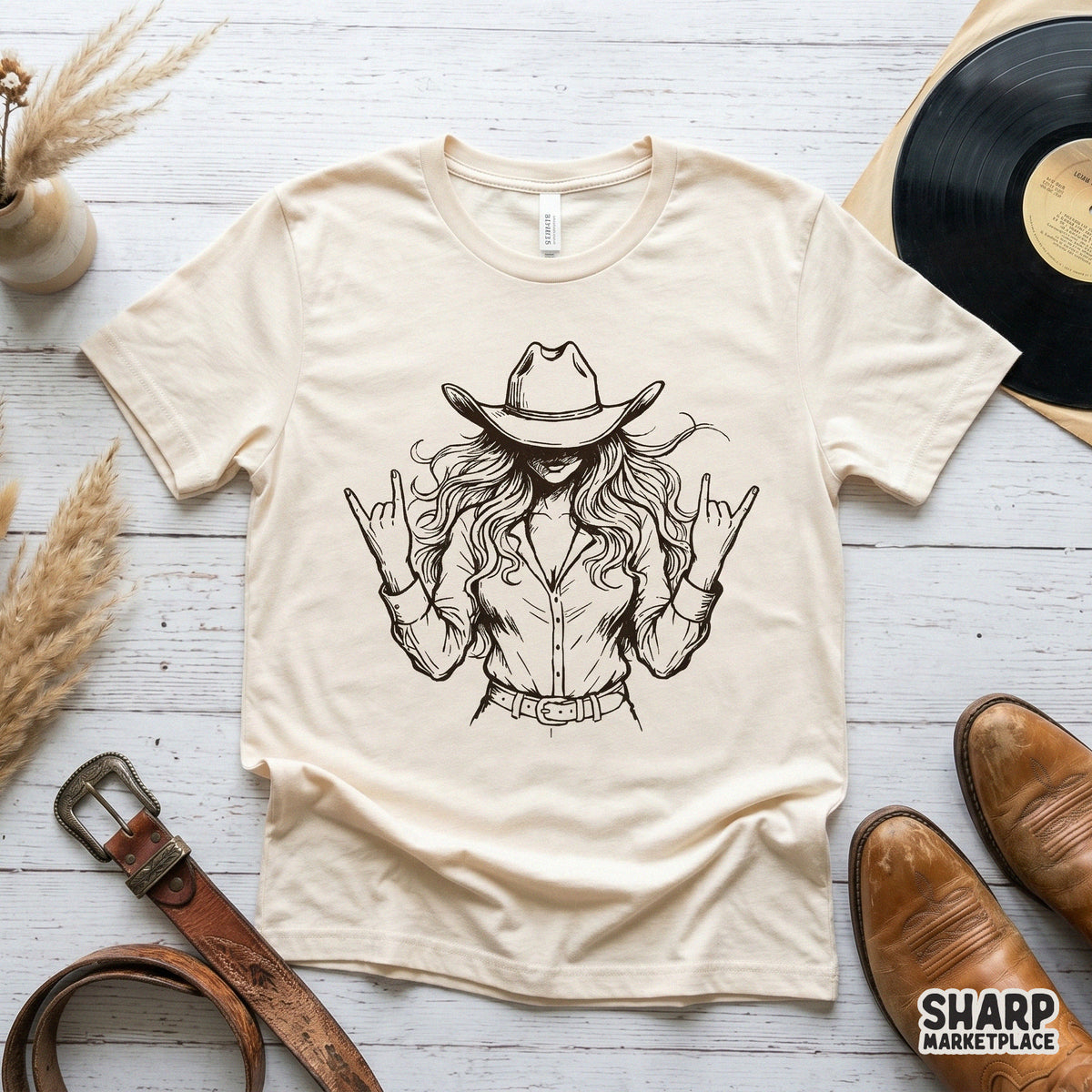 Black and white sketch of a rebellious cowgirl with flowing hair and a western hat, perfect for sublimation, stickers, or custom t-shirt designs.