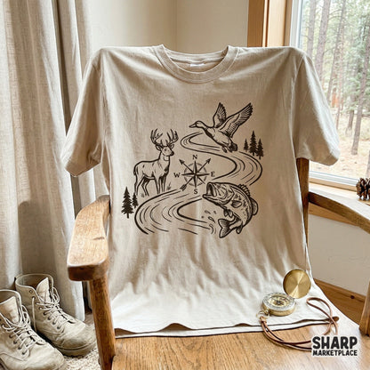 Vintage-inspired hunting and fishing digital art with a river, pine trees, and compass, ideal for custom tumblers, stickers, and masculine apparel designs.
