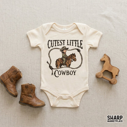 Vintage western graphic for apparel featuring a hand-drawn child in a cowboy hat riding a pony, framed by a rope lasso and distressed text.