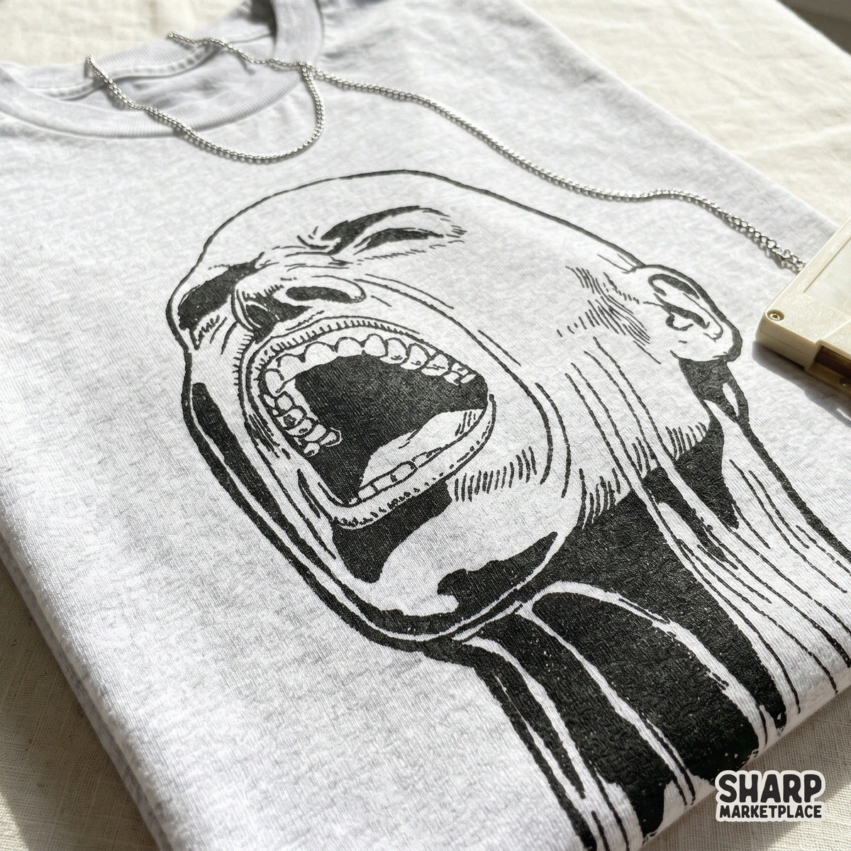 Detailed digital illustration of a raw, wide-mouthed screaming face in a sketch style, suitable for custom sublimation designs and edgy stickers.