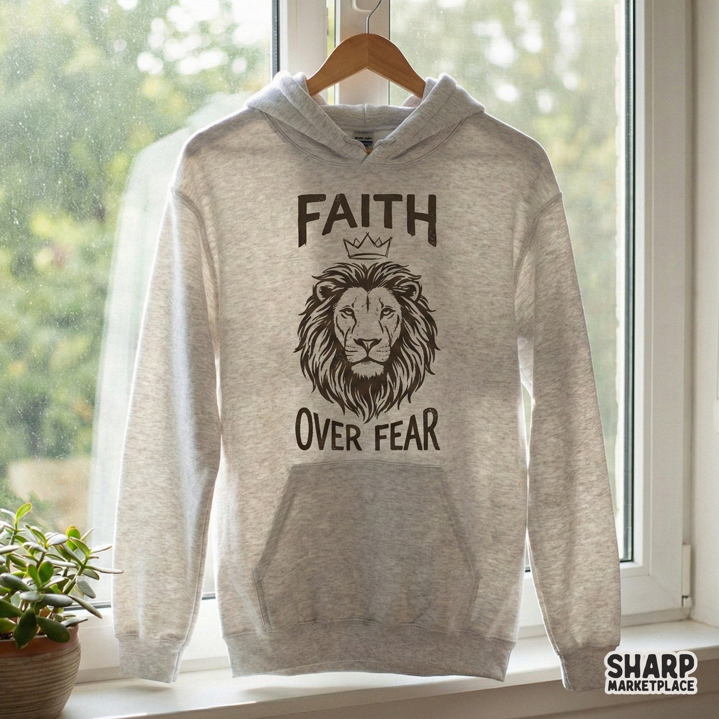 Inspirational lion head illustration with a crown and bold Faith Over Fear typography, ideal for DIY stickers, tumblers, and Christian-themed gifts.