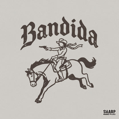 Distressed brown Bandida graphic featuring a cowgirl on a galloping horse with a pistol and flowing scarf, arched western text for sublimation designs.