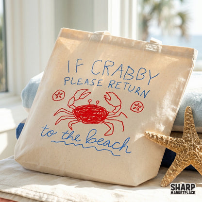 Tote bag featuring a playful red crab doodle and blue typography that says If Crabby Please Return To The Beach, perfect for summer coastal apparel.