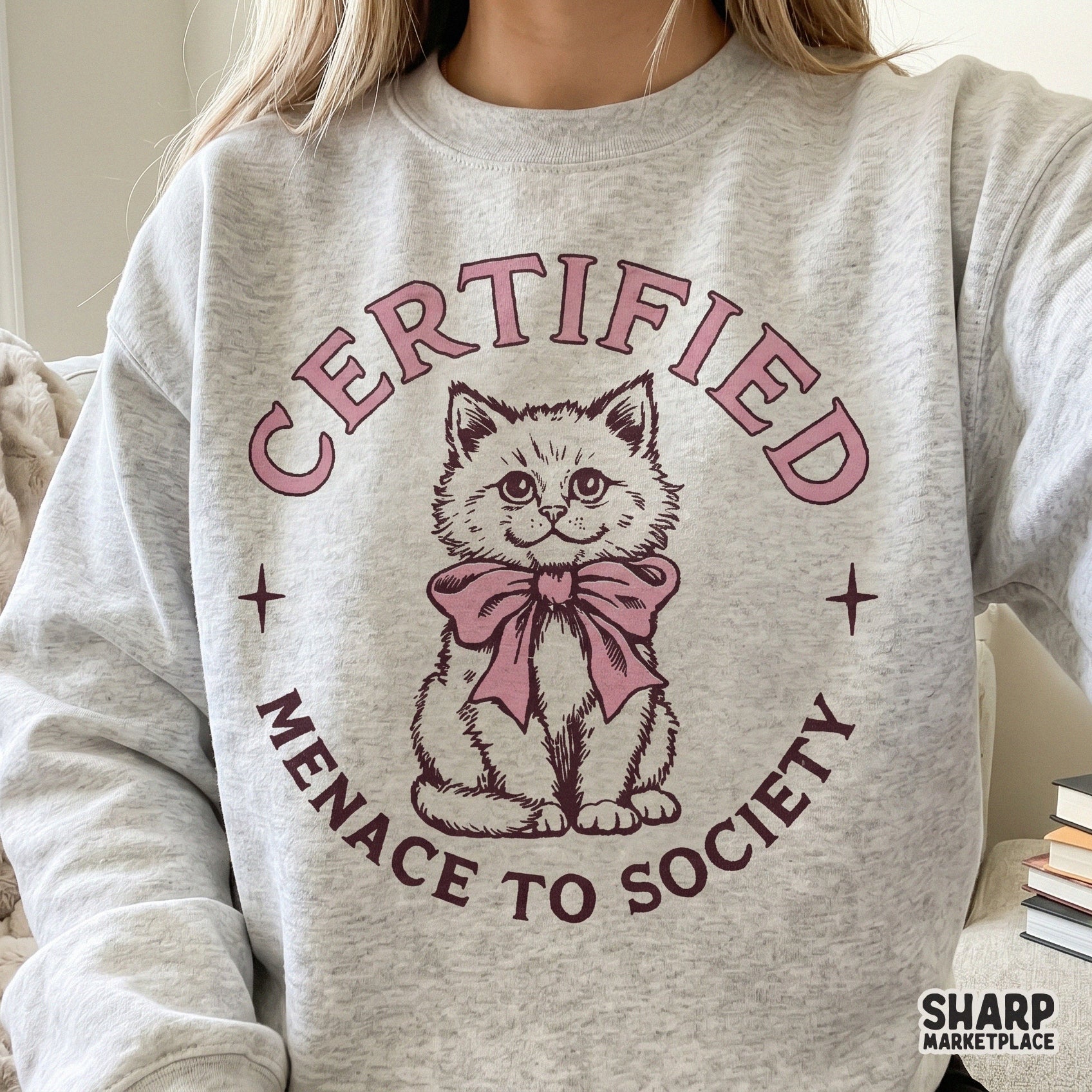 Funny kitten menace to society graphic with a pink bow in a trendy retro y2k coquette png style for cat lovers