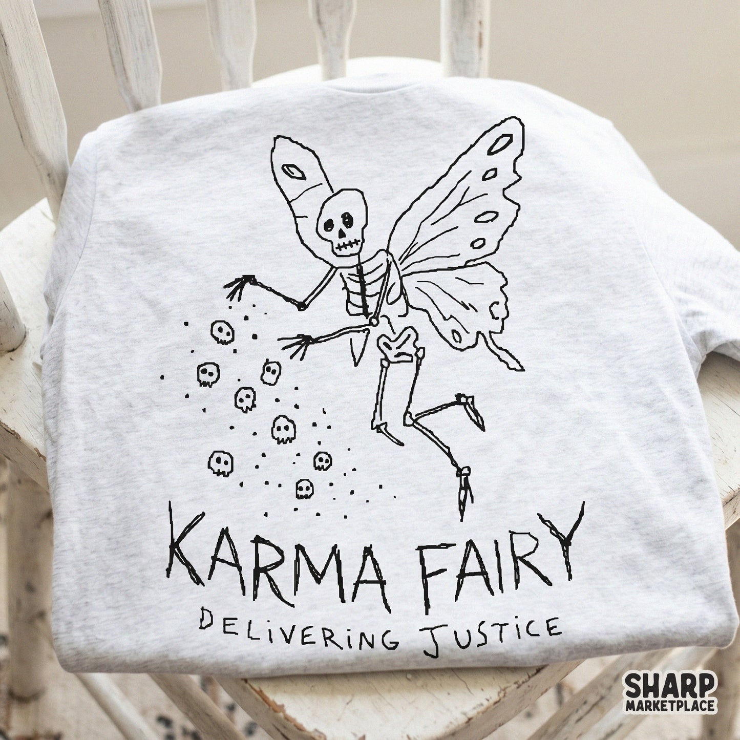 Retro-style black and white illustration of a skeleton fairy with butterfly wings and falling skulls, ideal for print-on-demand shirts and dark academia crafts.