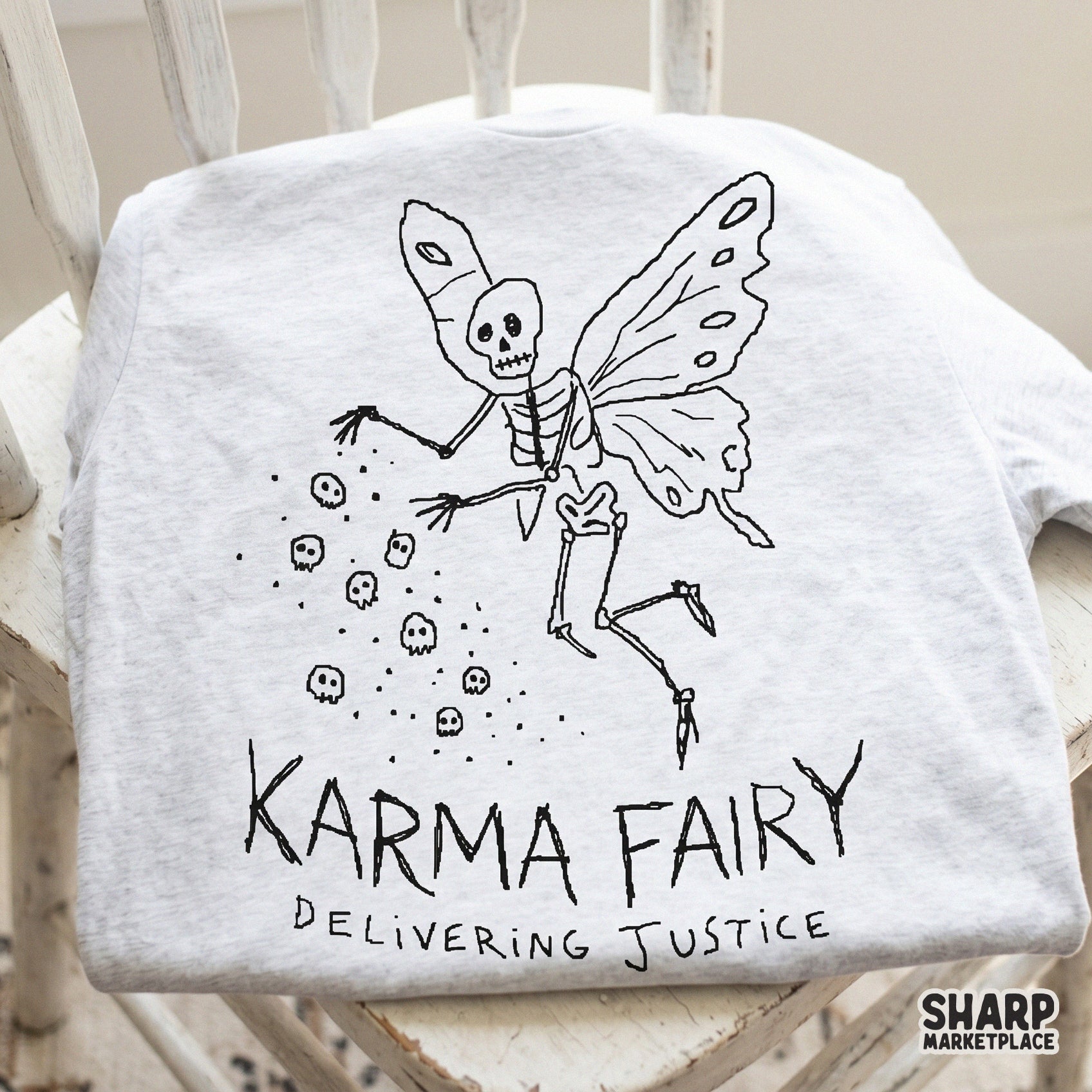 Retro-style black and white illustration of a skeleton fairy with butterfly wings and falling skulls, ideal for print-on-demand shirts and dark academia crafts.