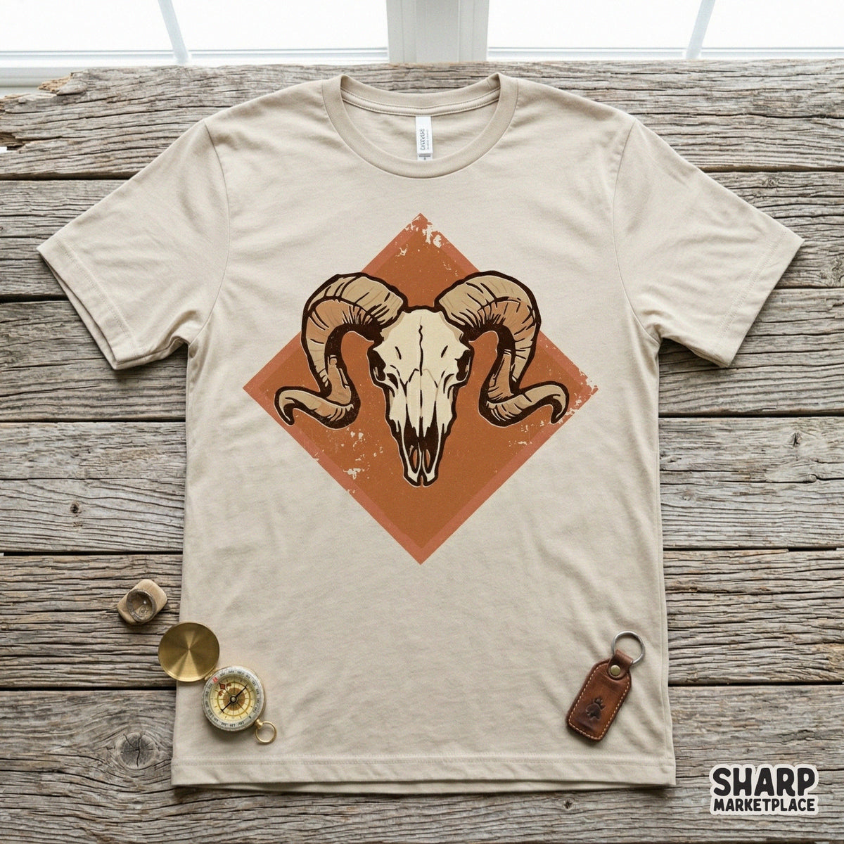 A rustic ram skull graphic featuring a vintage desert diamond background, showcased as a digital design file for custom t-shirt printing and DIY projects.