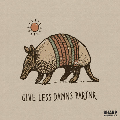 Hand-drawn armadillo illustration with a rustic sun and the text Give Less Damns Partnr in a vintage, distressed western style.