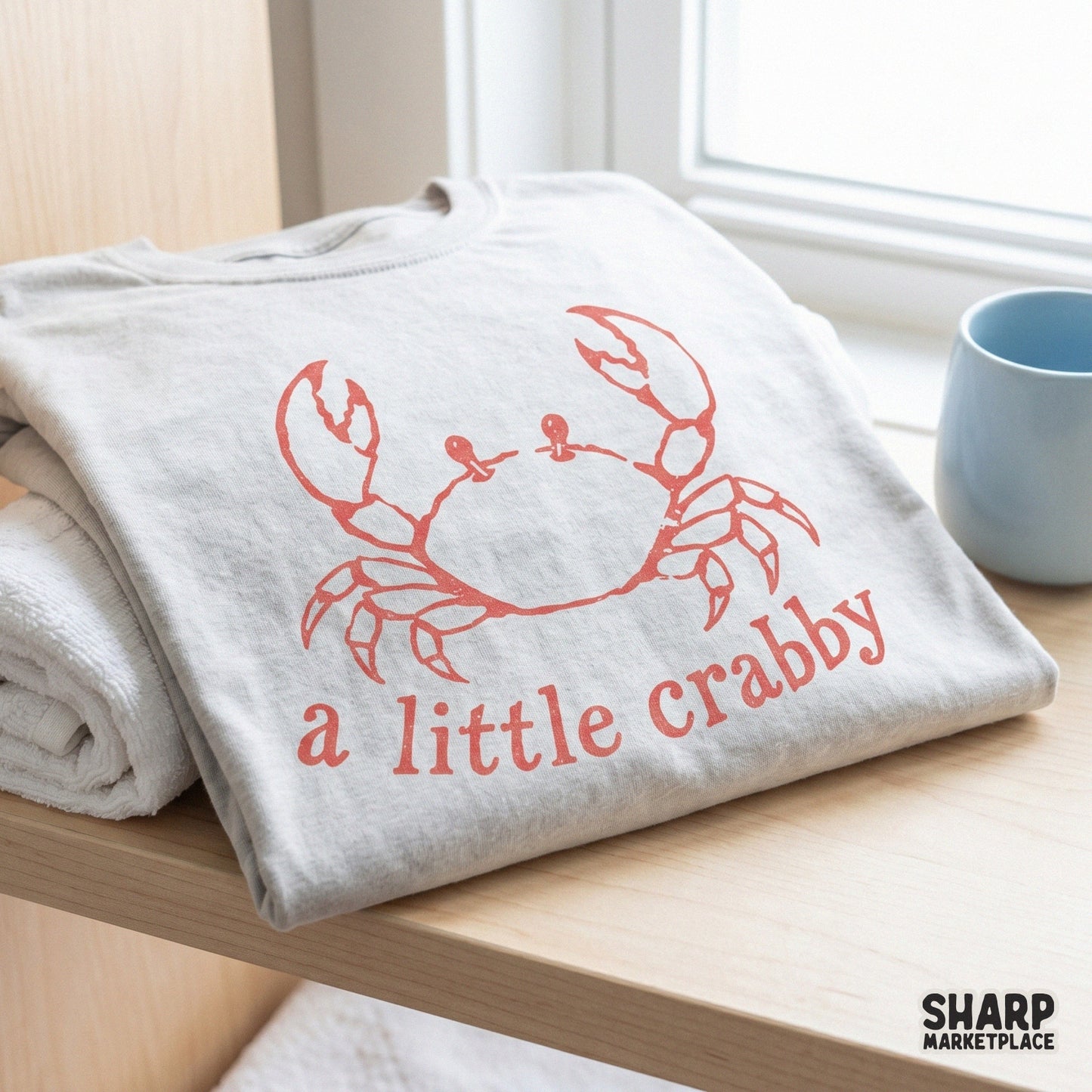 Playful coastal design with a hand-drawn crab and the words a little crabby, designed for trendy apparel, DTF transfers, and seasonal beach crafts.