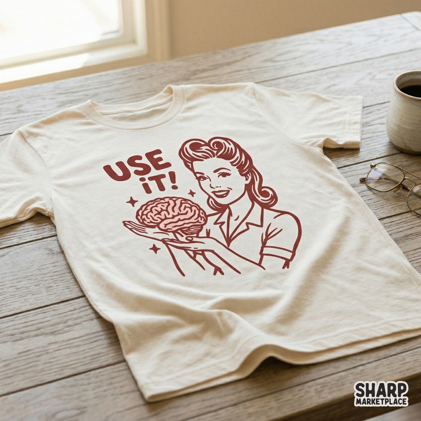 Vintage inspired graphic featuring a woman holding a brain with the words Use It! printed on a cream colored t-shirt for apparel design.