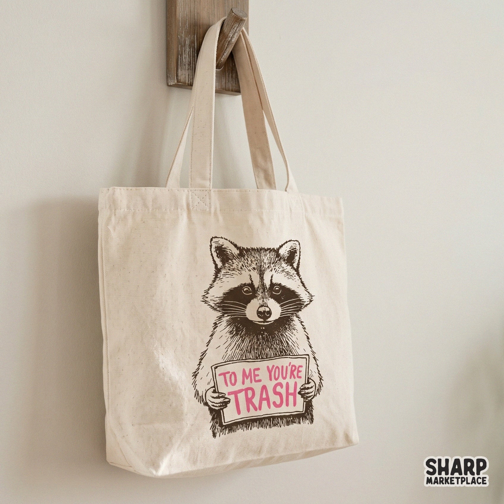 Snarky animal design featuring a realistic raccoon with a sign reading To Me You Are Trash, ideal for high-quality sublimation and custom clothing prints.