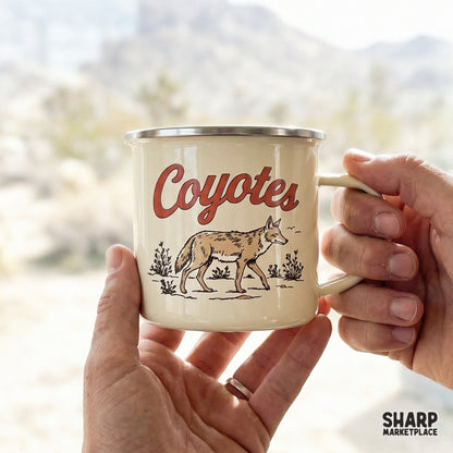 Hand-drawn coyote walking through desert plants with vintage orange text, a versatile digital file for western-inspired apparel designs.