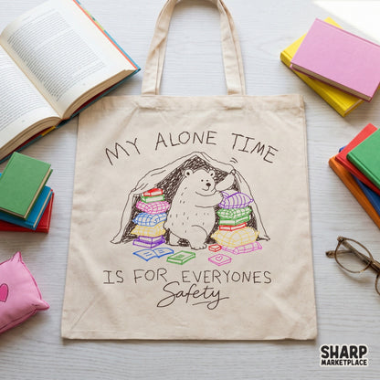 Whimsical digital design of a bear reading in a pillow fort surrounded by books, perfect for sublimation shirts, stickers, and bookish apparel projects.