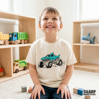 Playful shark monster truck design featuring bold black ink outlines and a bright blue finish, perfect for kids racing shirts and trendy streetwear.