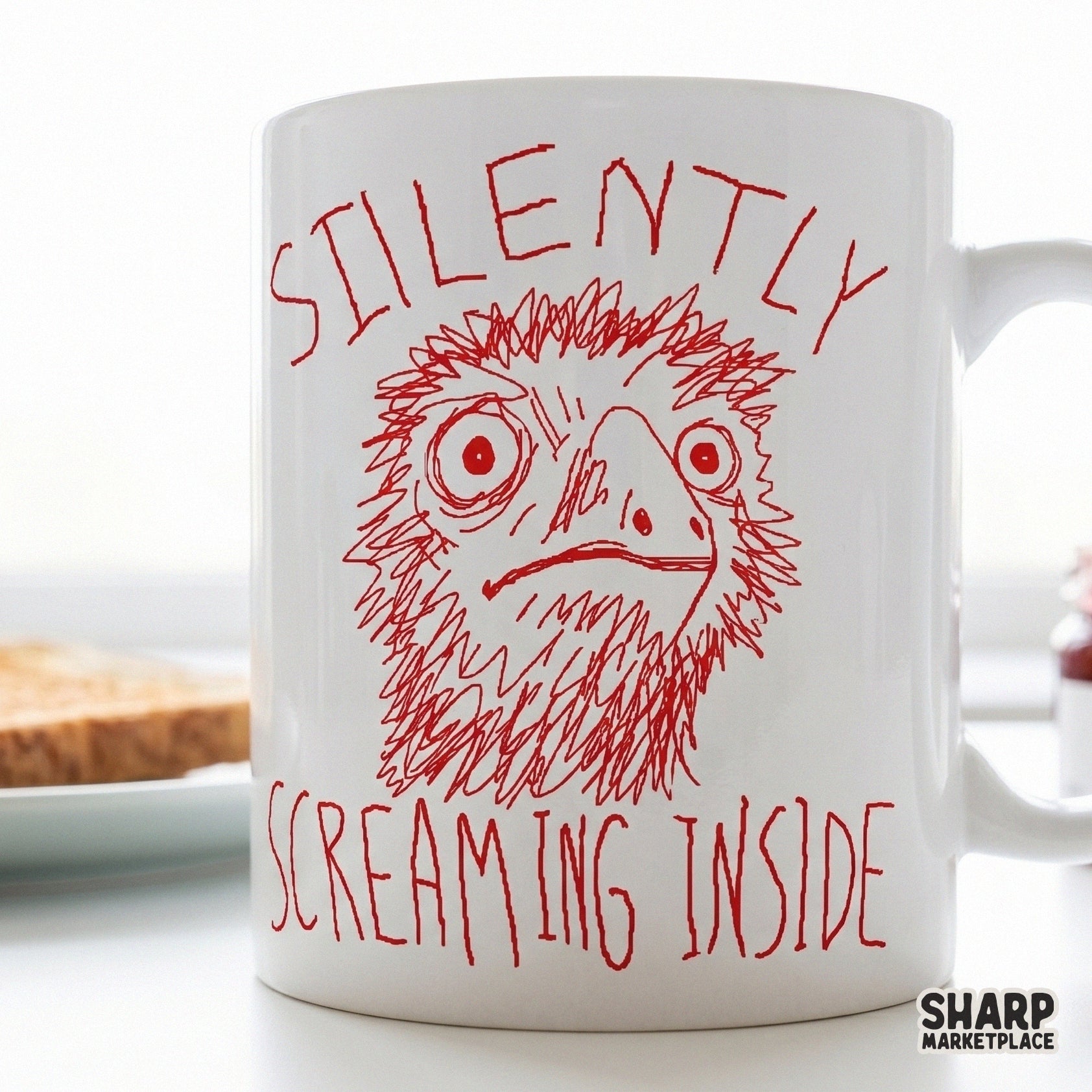 A white coffee mug featuring a distressed, hand-drawn red bird illustration with the sarcastic caption Silently Screaming Inside in red ink.