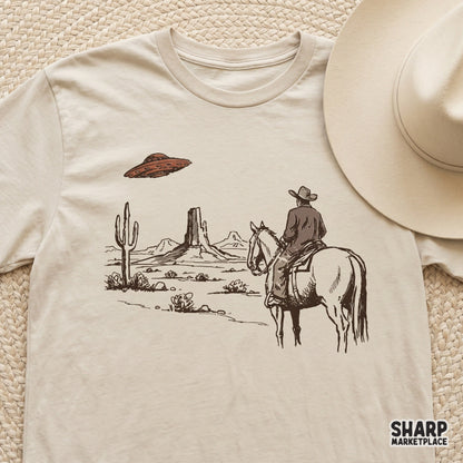 Sepia-toned cowboy and UFO desert artwork, a versatile digital download for creating unique western-themed apparel and trendy DIY craft projects.