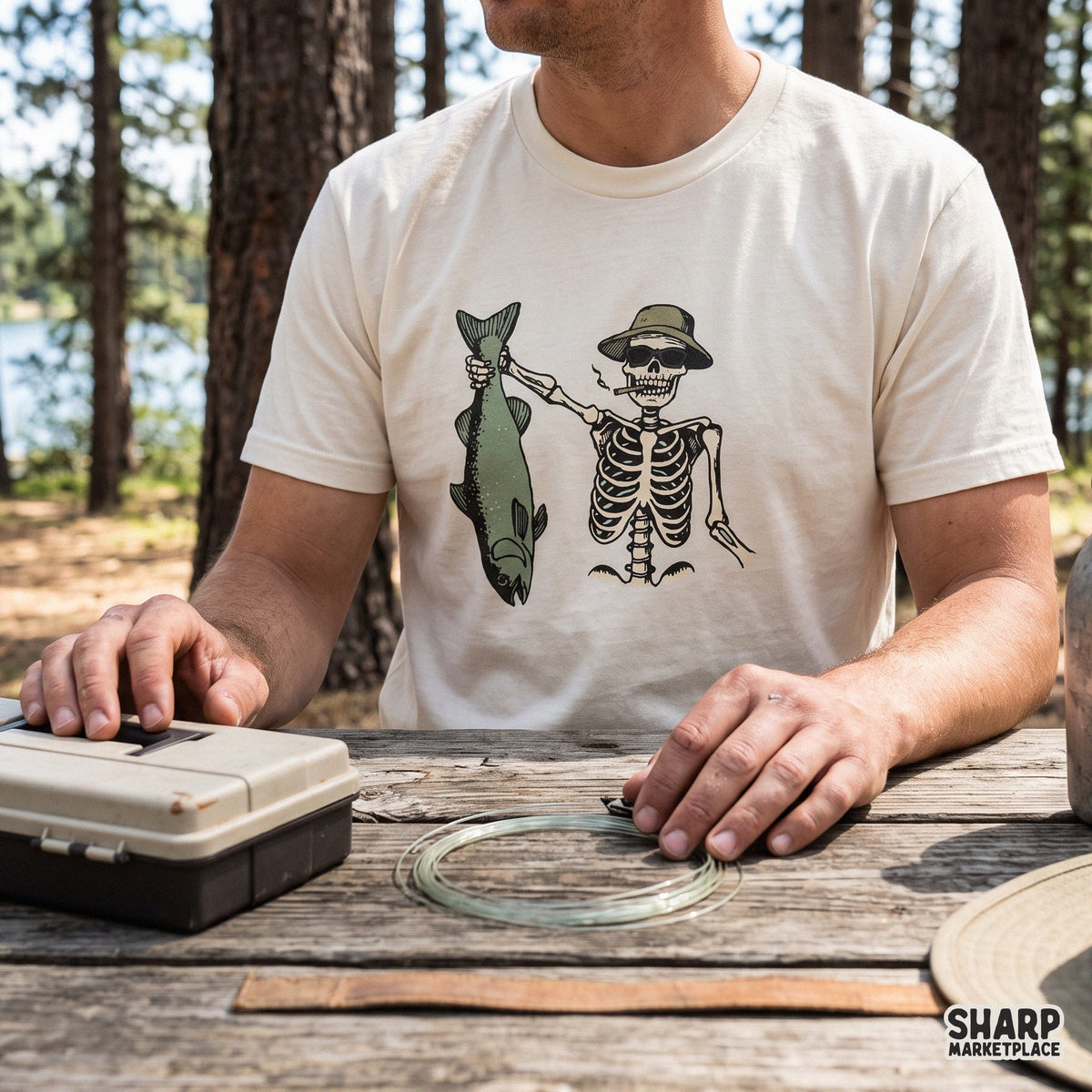 Cool skeleton in bucket hat holding fish and rod PNG design for funny summer fishing t-shirts and fisherman gifts