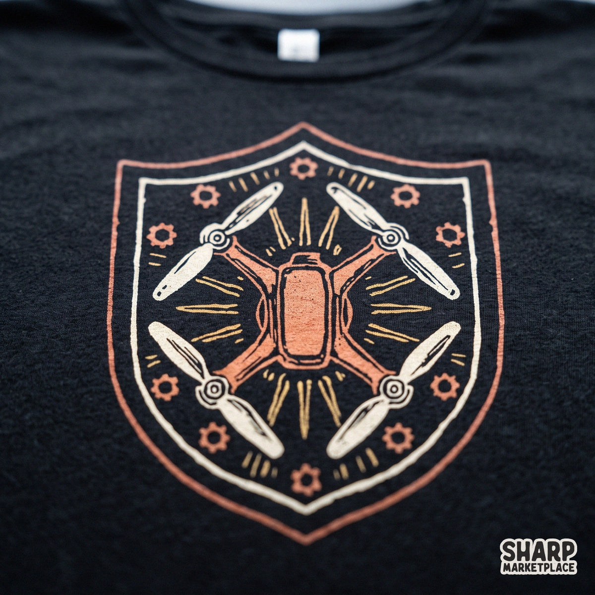 Vintage drone shield emblem featuring a quadcopter crest and mechanical gears PNG for shirt printing
