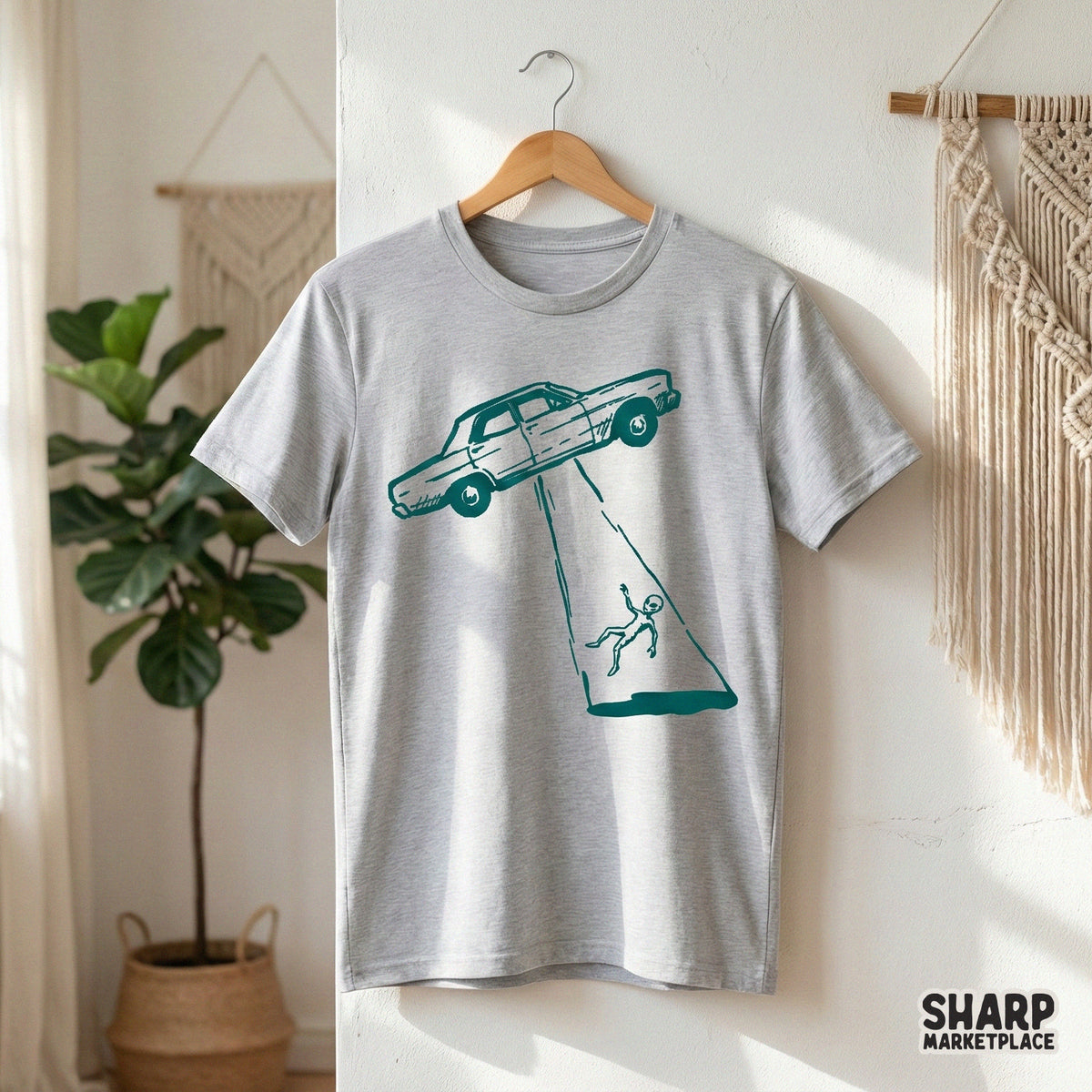 Vintage-style alien abduction graphic with a sketchy aesthetic, perfect for custom printable t-shirts, quirky wall art, or unique science fiction gifts.