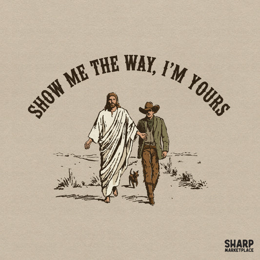 Vintage western style digital design featuring Jesus leading a cowboy and dog through a desert, with arched text reading Show Me The Way, I'm Yours.