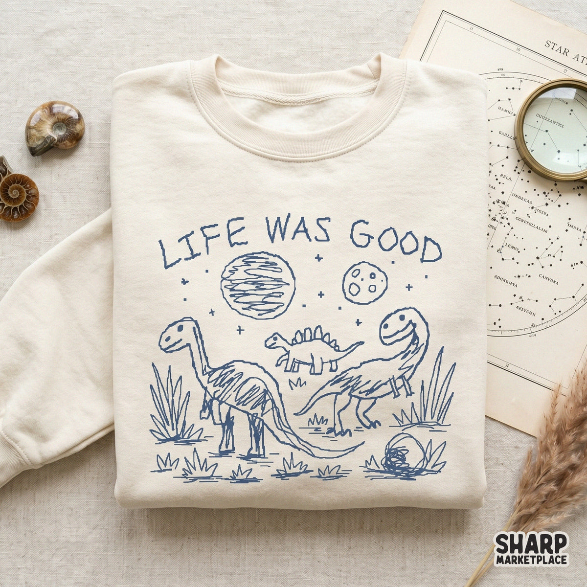 Funny prehistoric scene with three dinosaurs and celestial elements, designed as a high-resolution digital file for heat transfers and apparel.