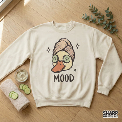 Whimsical hand-drawn mallard duck in a spa relaxation pose with cucumber eyes and sparkling accents, ideal for custom t-shirt or tumbler designs.