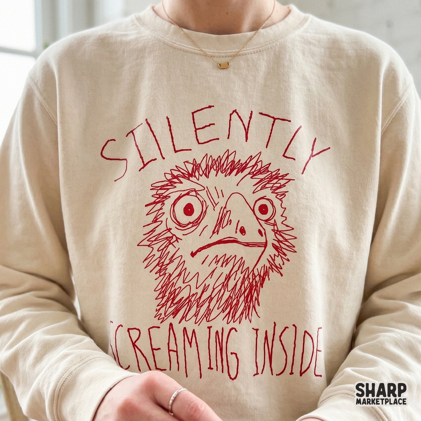 Digital download graphic of a chaotic, sketchy red bird with wide eyes and the phrase Silently Screaming Inside, perfect for funny apparel and stickers.