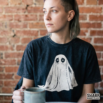 Cute vintage illustration of an adorable cat wearing a ghost sheet costume for a Halloween spooky tee shirt design