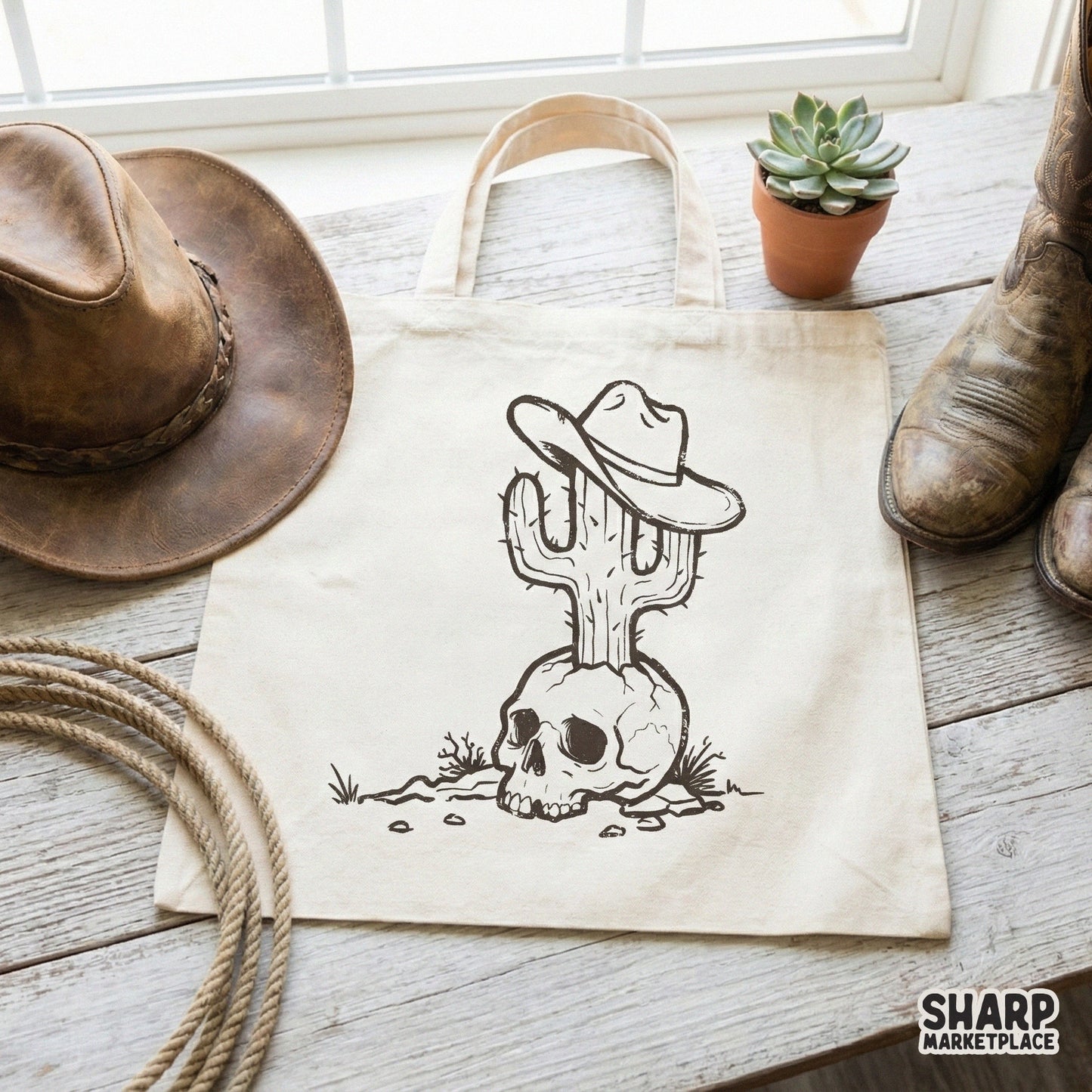 Retro western outlaw style graphic of a skull with a cactus and cowboy hat, presented as a digital design for t-shirts, stickers, and sublimation.